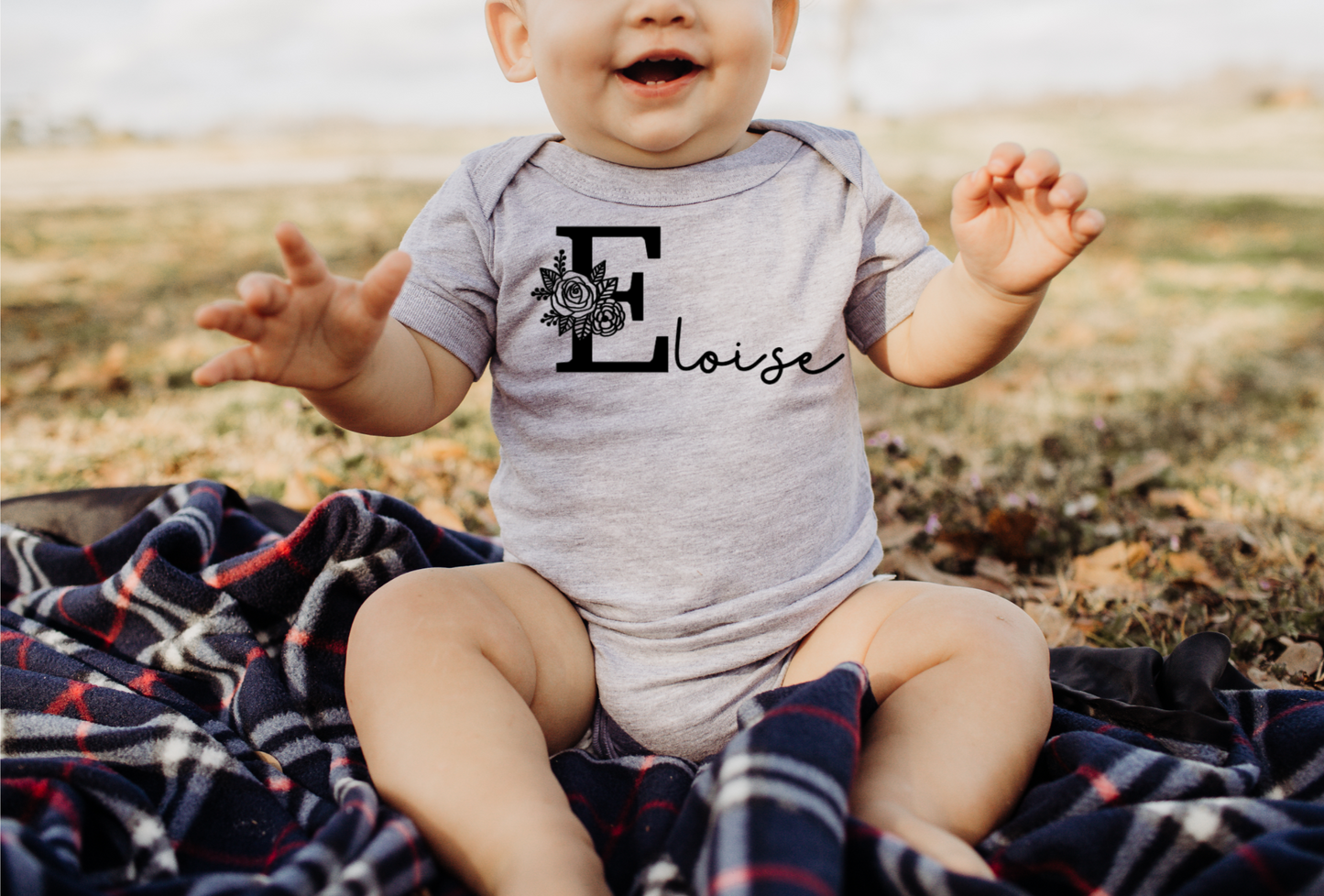 FLORAL INITIAL BODYSUIT